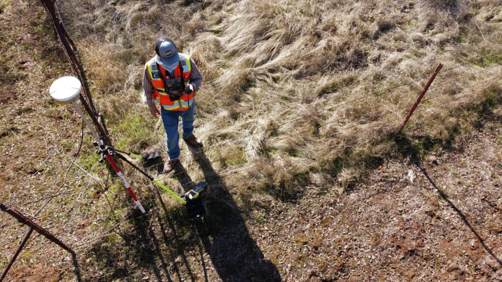 image of a surveyor from a drone - Iverson Forest Management Geospatial GIS Management & Applications Services